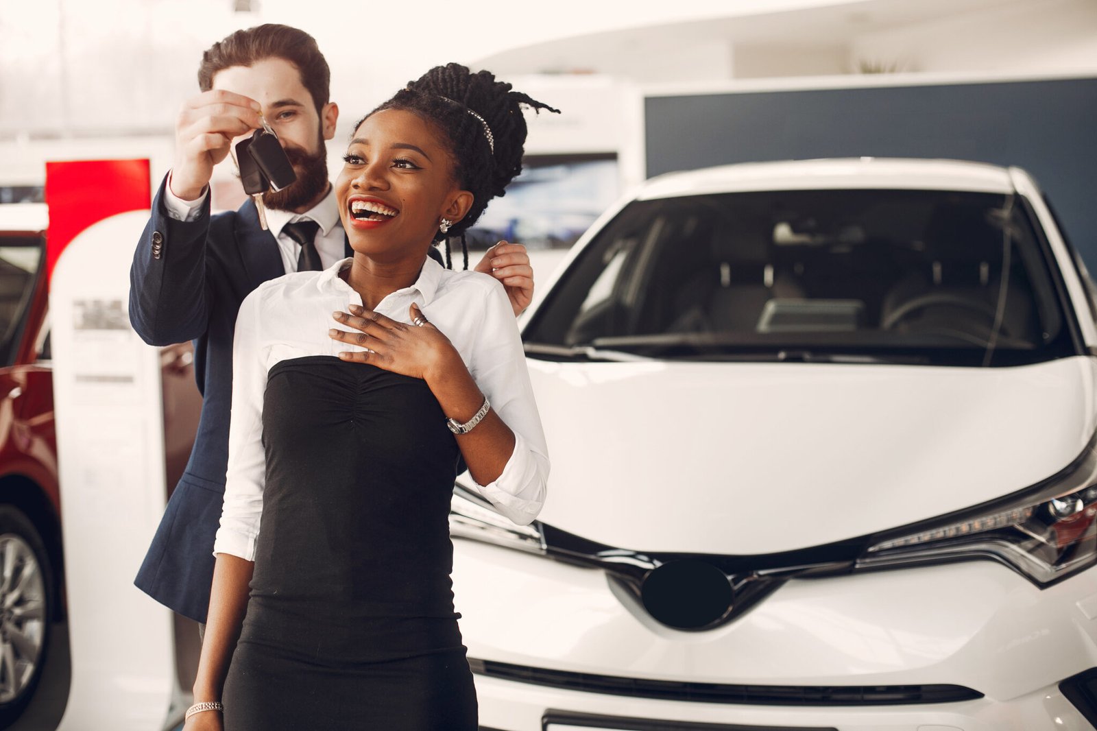 Customers exploring vehicles in a car showroom